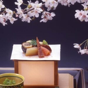 Cherry blossoms above a traditional meal with teapot and small dishes at Asadaya, Chūbu Ishikawa Japan