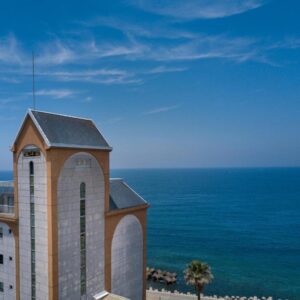 Seafront tower facade with arched windows, Boyokaku ryokan on Kumamoto coast, Kyushu