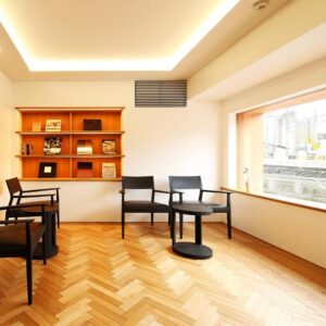 Bright wooden-floored seating area with chairs and window at Ichidaya, Hyōgo, Kansai, Japan