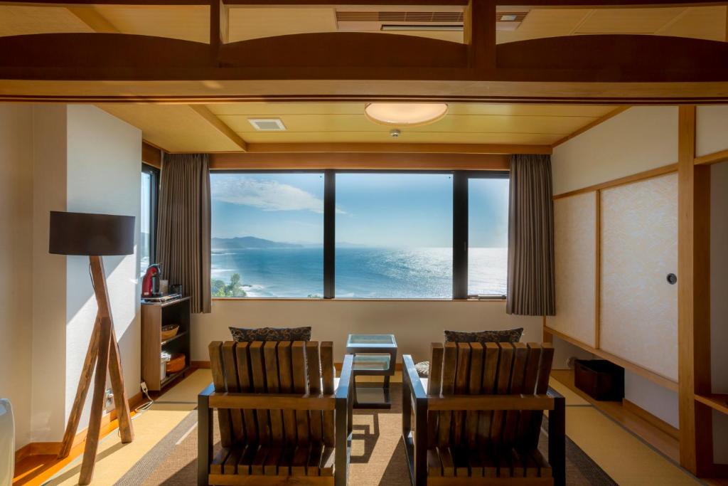 Sea view tatami room Jukaitei Kyoto Tatami seating area facing a large window with coastal view at Jukaitei in Kyoto, Kansai