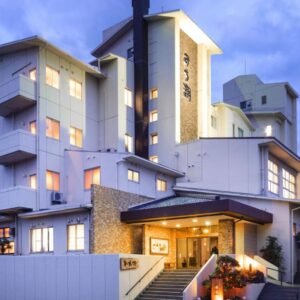 Lit entrance and multi-story facade of Michishio with balconies, Mie Prefecture, Kansai, Japan