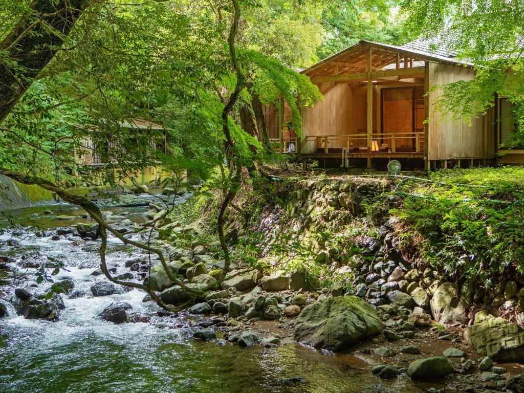 Riverside Wooden Cabin at Mizumari Shizuoka Riverside wooden cabin with deck beside mossy stream at Mizumari in Shizuoka, Chūbu Japan