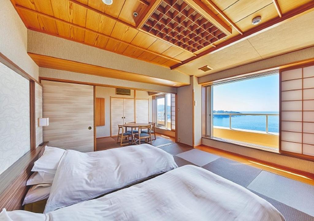 Tatami Room with Sea View Musashi Wakayama Tatami room with twin beds, shoji screens and sea view at Musashi in Wakayama
