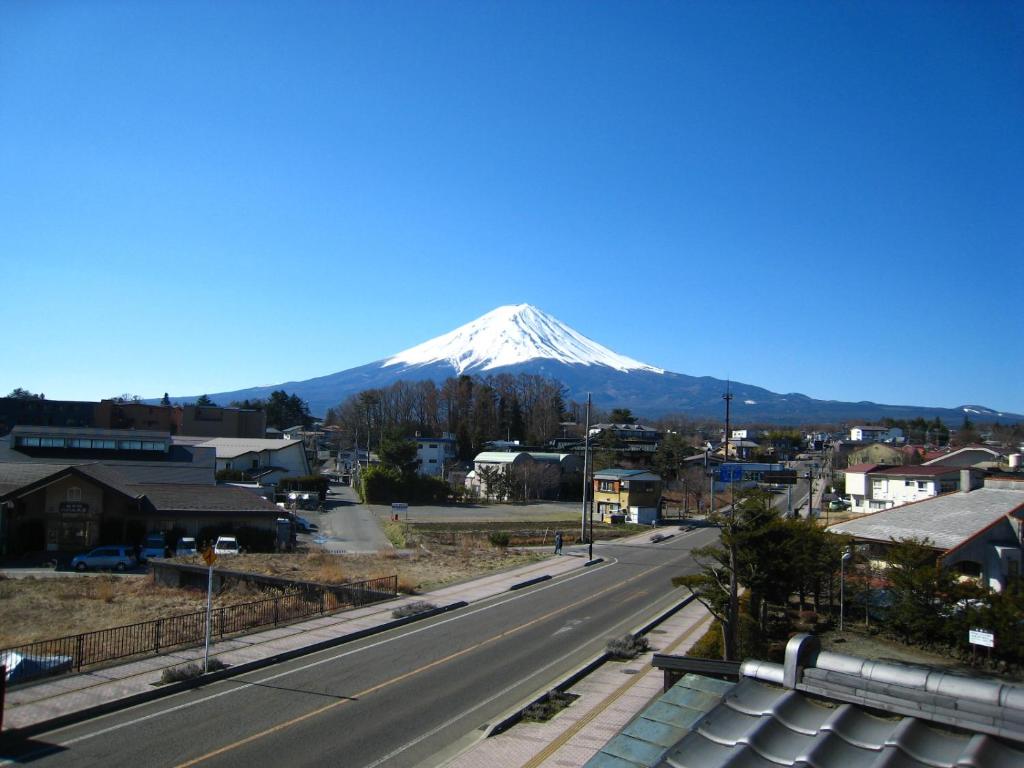 Snowcapped Mount Fuji View at Taiheikan Yamanashi Mount Fuji visible beyond town from Taiheikan in Yamanashi, Chūbu