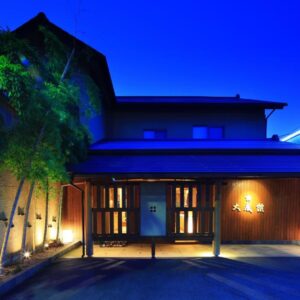 Nighttime entrance with lit facade and bamboo at Taiseikan, Shizuoka, Chūbu
