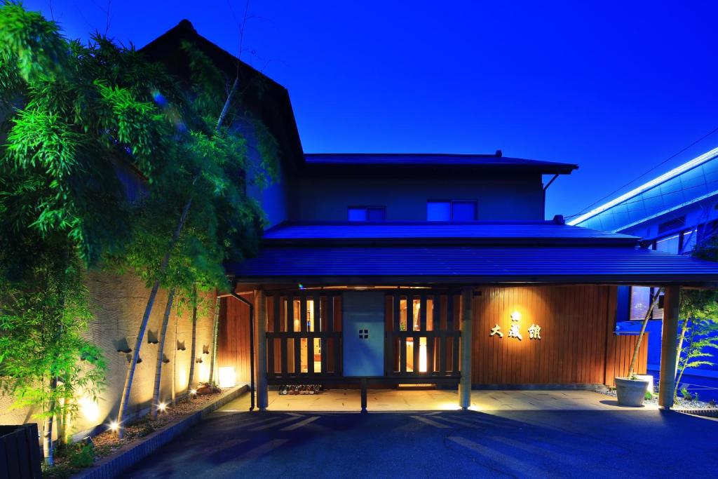 Evening facade of Taiseikan in Shizuoka Nighttime entrance with lit facade and bamboo at Taiseikan, Shizuoka, Chūbu