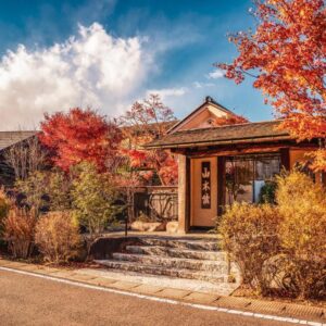 Entrance framed by autumn foliage at Yamakikan in Gunma Kantō