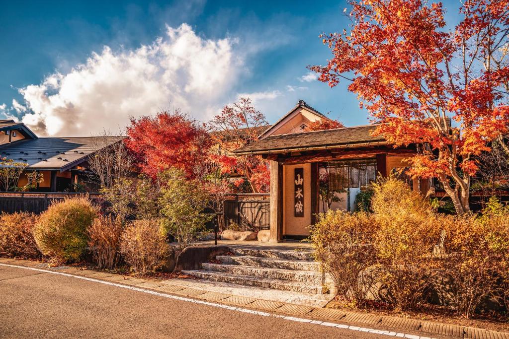 Autumn entrance at Yamakikan Gunma Japan Kantō Entrance framed by autumn foliage at Yamakikan in Gunma Kantō