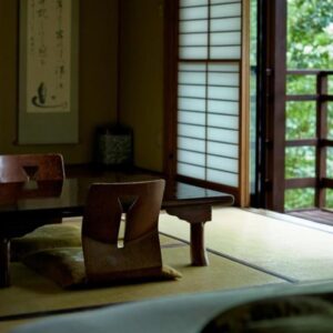 Sunlit tatami room with low table and shoji doors at Nakadana-sō, Nagano, Chūbu Japan