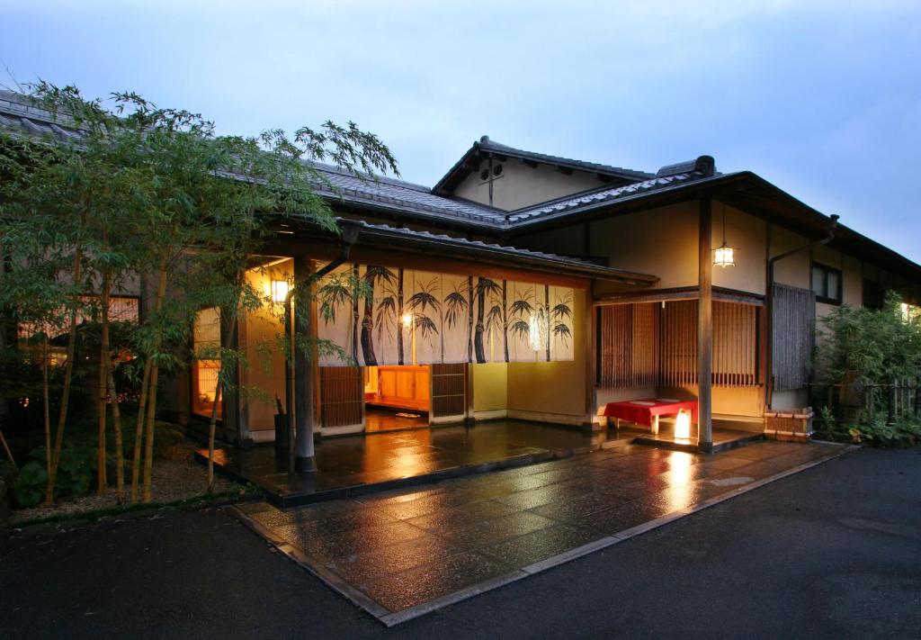 Evening ryokan entrance Oyado Chikurintei Saga Illuminated wooden entrance with bamboo landscaping at Oyado Chikurintei in Saga, Kyushu, Japan